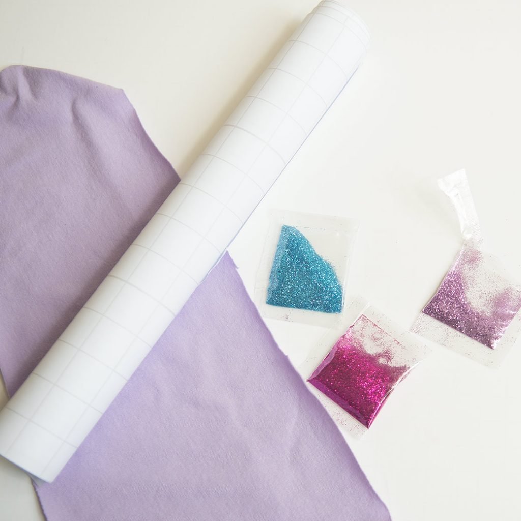 glitter, cotton jersey, iron-on vinyl to make laminated fabric
