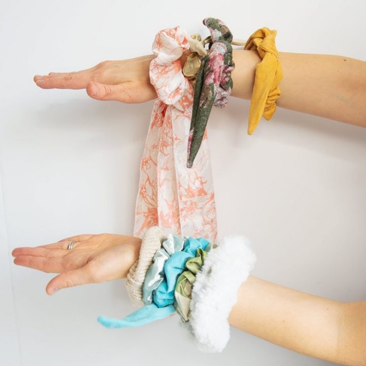 hands wearing scrunchies